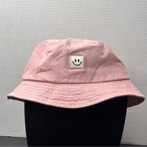 light pink bucket hat with smiley face